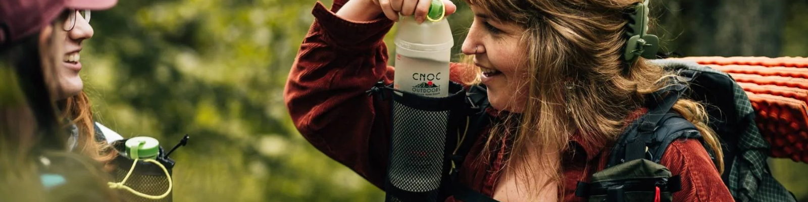 ultralight backpacking accessories - woman with water holder